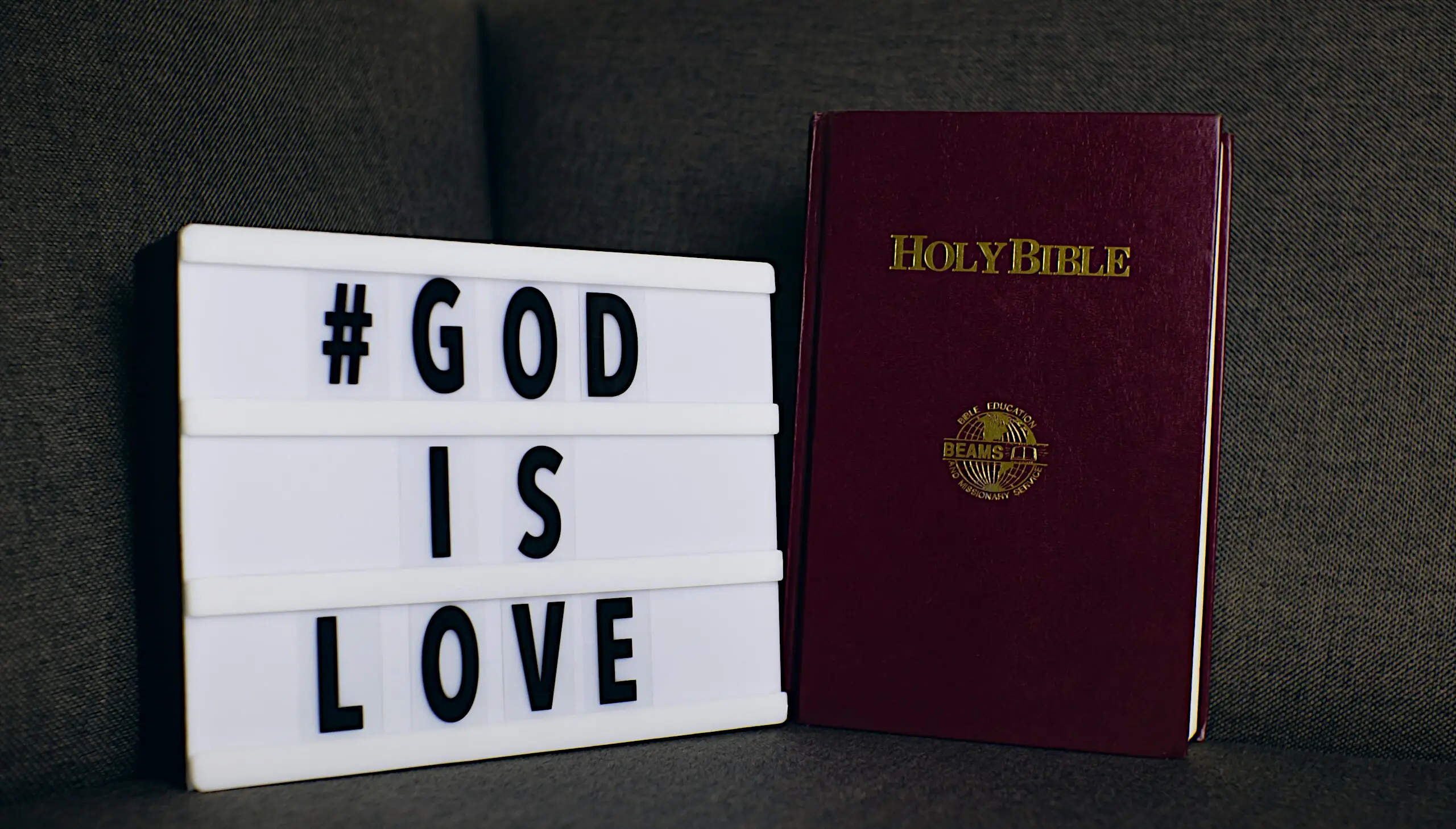 God is Love sign with Bible